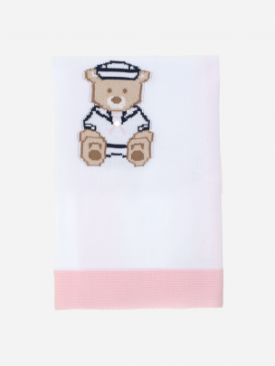 White and pink knitted blanket with teddy bear